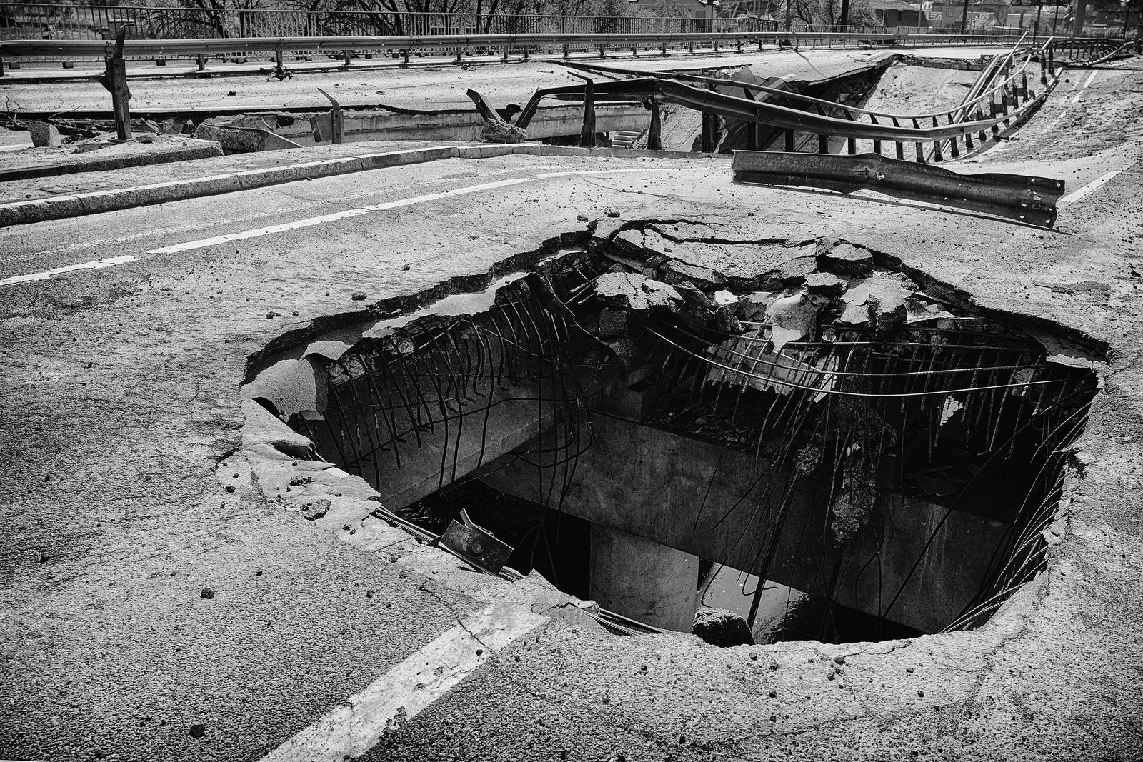 A giant hole in a street.