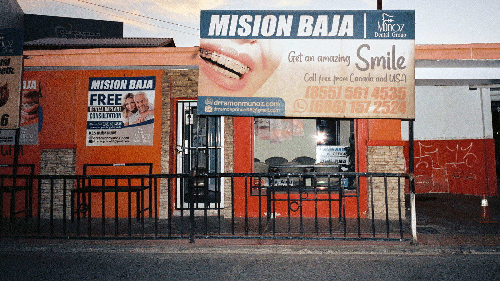 A billboard advertising a dental service.
